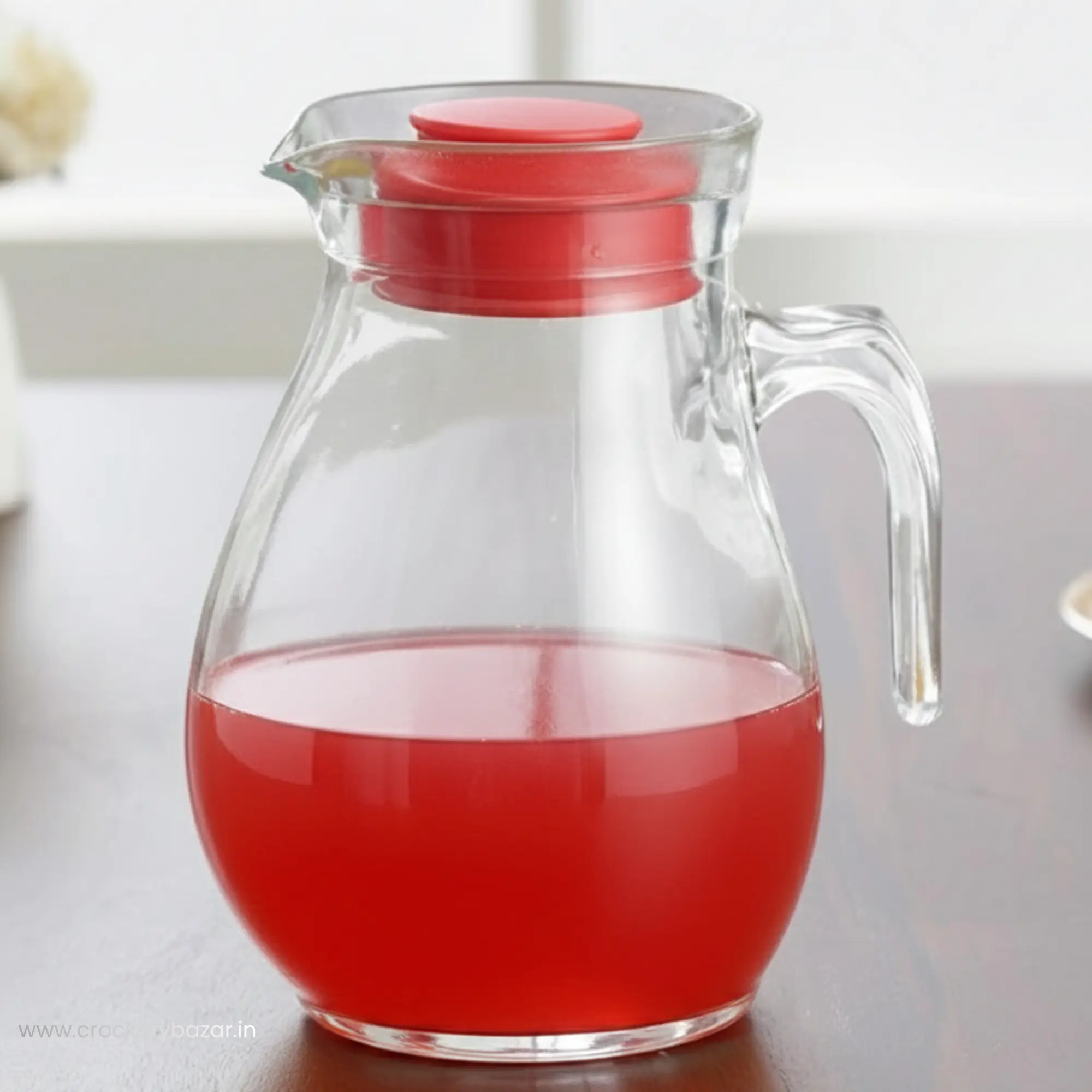 Closeup of Bormioli Rocco Sangria 1.5 Ltr glass jug for water serving filled with chilled red sherbet