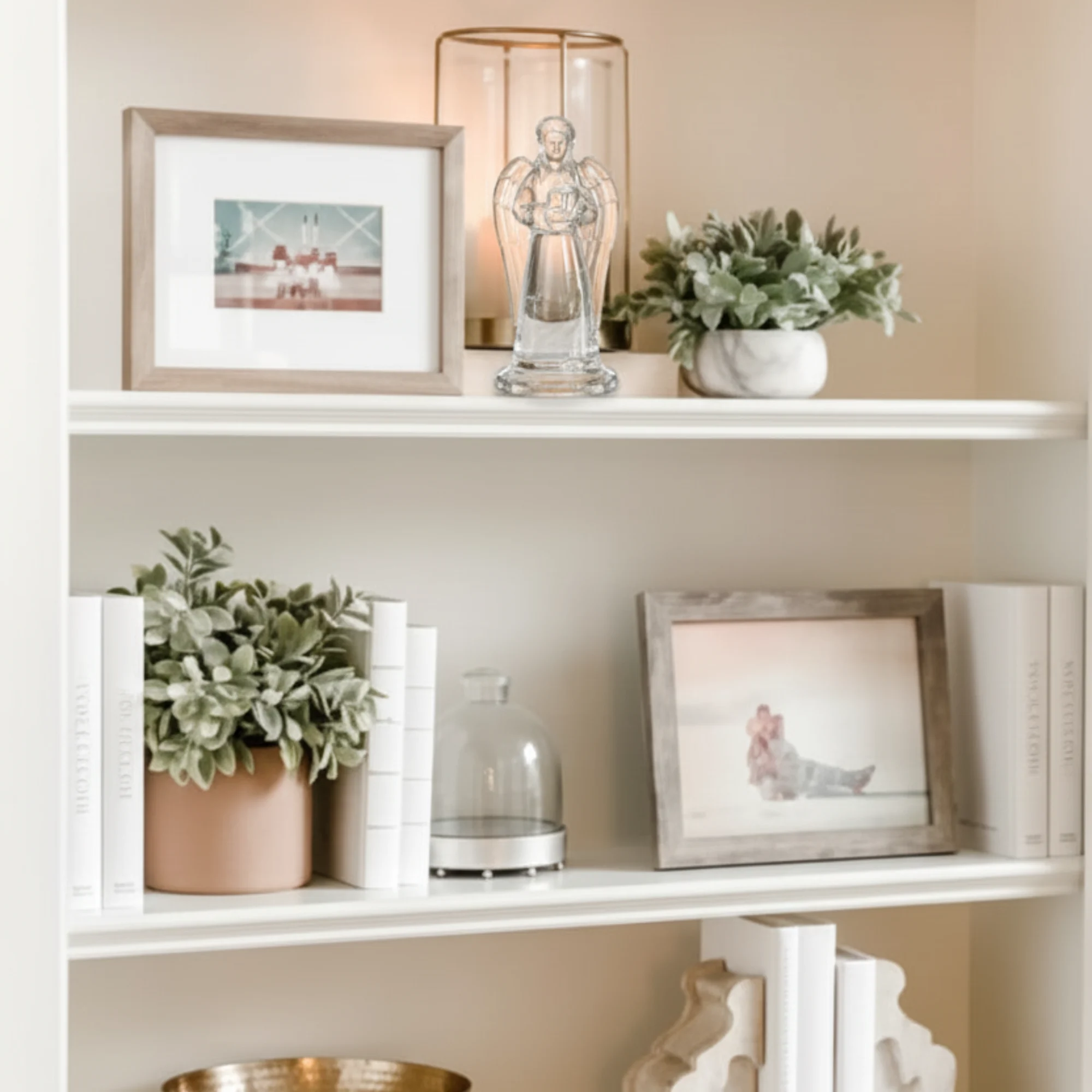 17.9cm Cristal D’Arques Paris Ange angel figurine displayed on a white living room shelf alongside decorative books and plants.