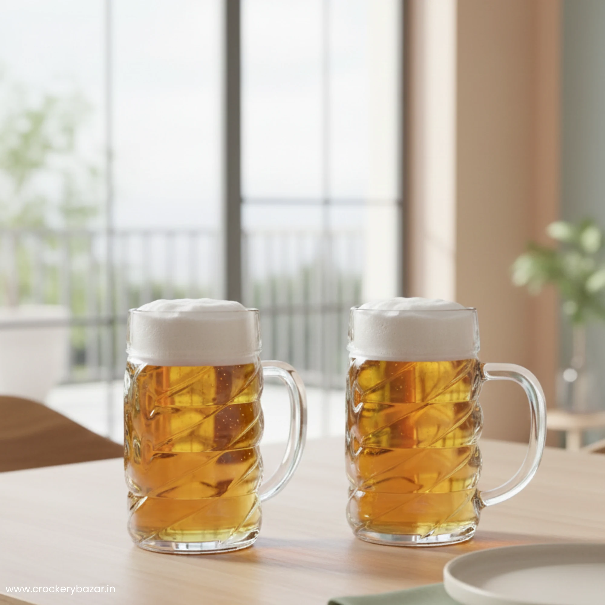 Two 500ml glass beer mugs filled with lager on a wooden dining table near a bright window.