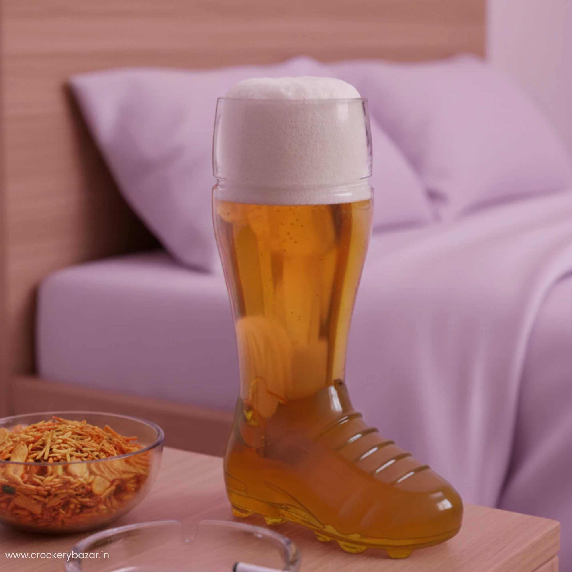 Borgonovo boot beer glass on a bedside table with a bowl of snacks and a purple bed background.