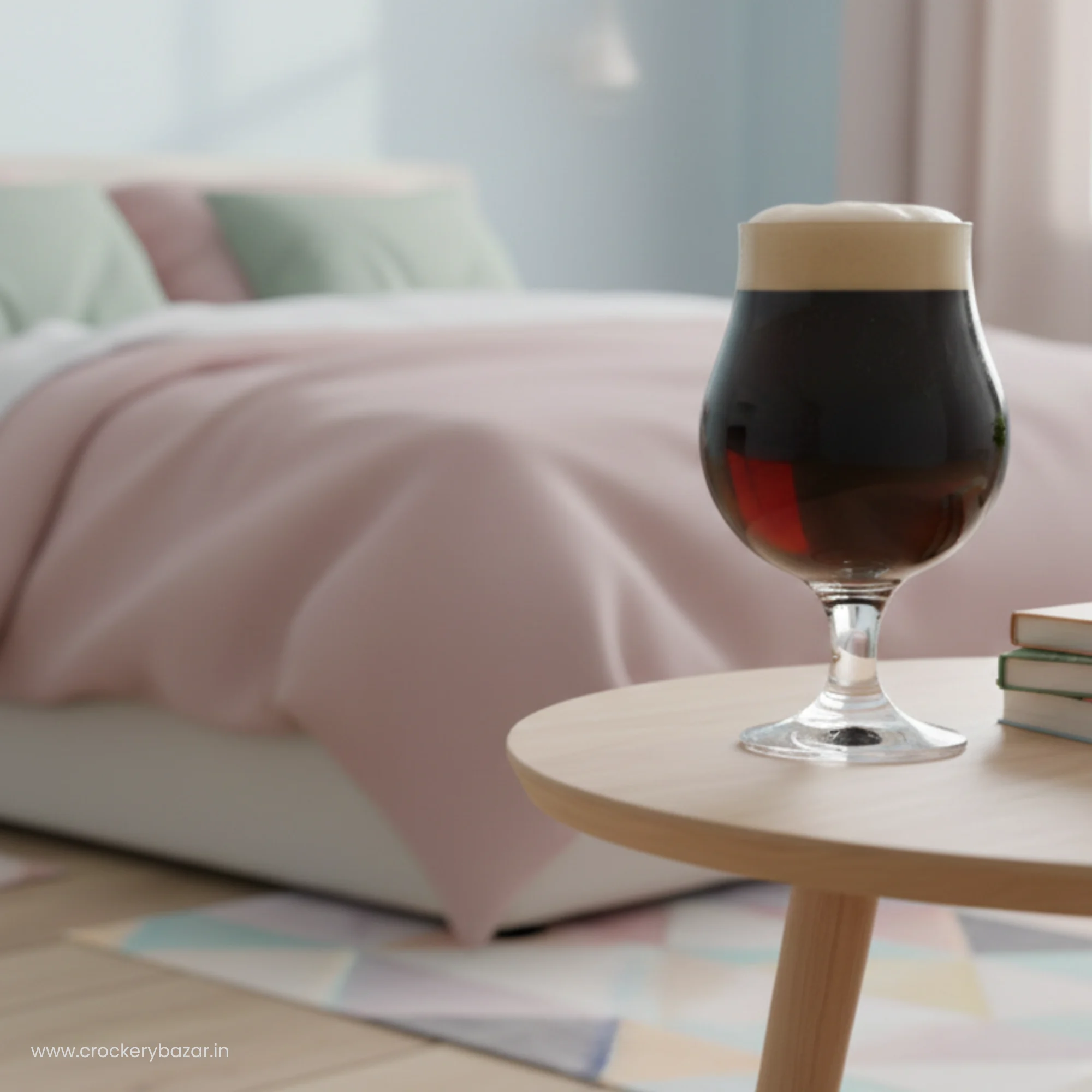 A single Dublin 400ml stemmed glass filled with a dark stout beer on a wooden bedside table in a modern bedroom.