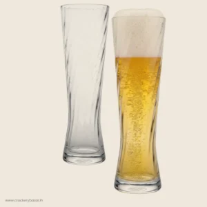 Two Durobor 625ml spiral beer glasses, one empty and one full.