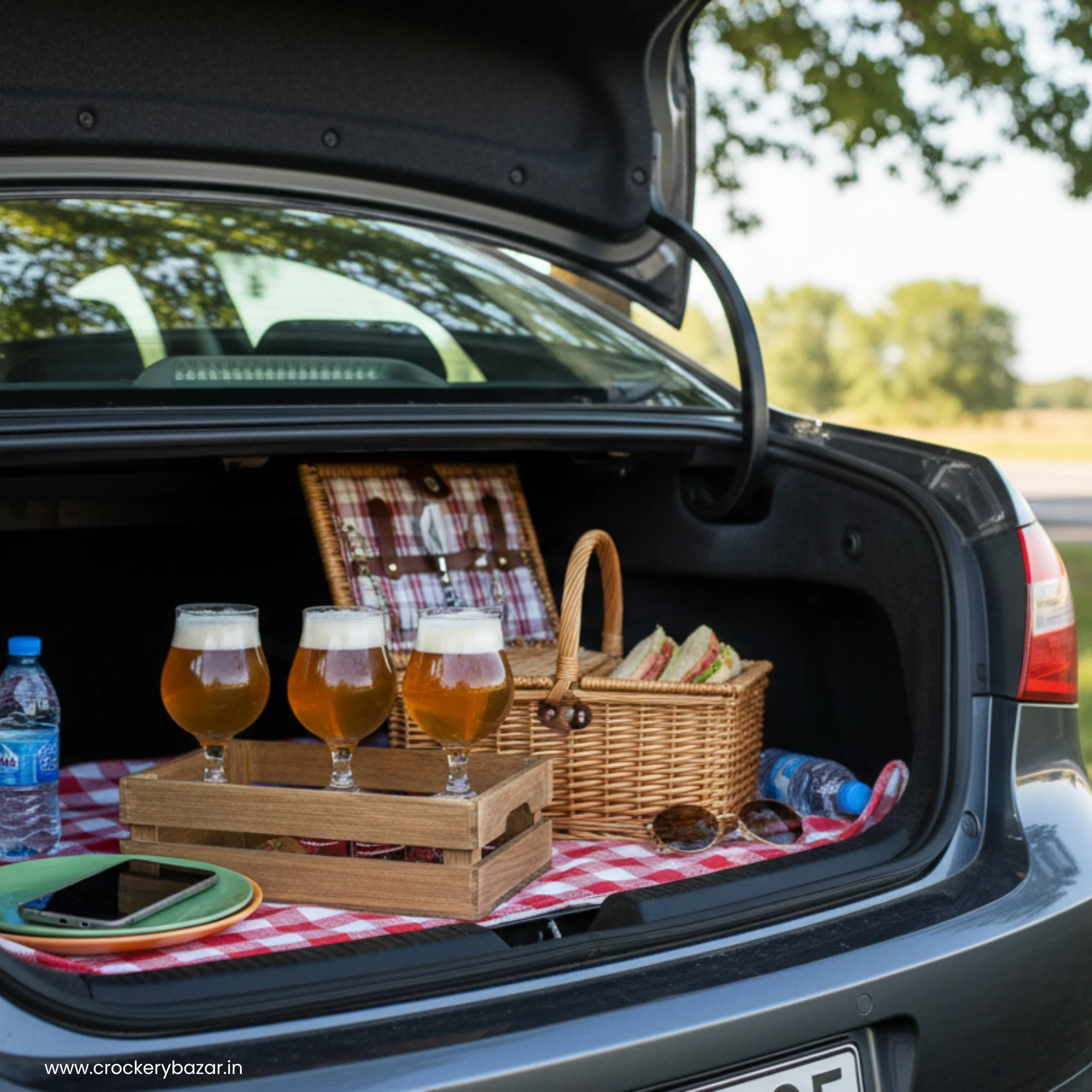 Three Dublin 400ml stemmed beer glasses in a wooden crate inside a car trunk setup for a roadside picnic.