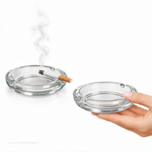 Bormioli Rocco Poker Italian glass small ashtray for smoking held in hand to show 8cm scale.