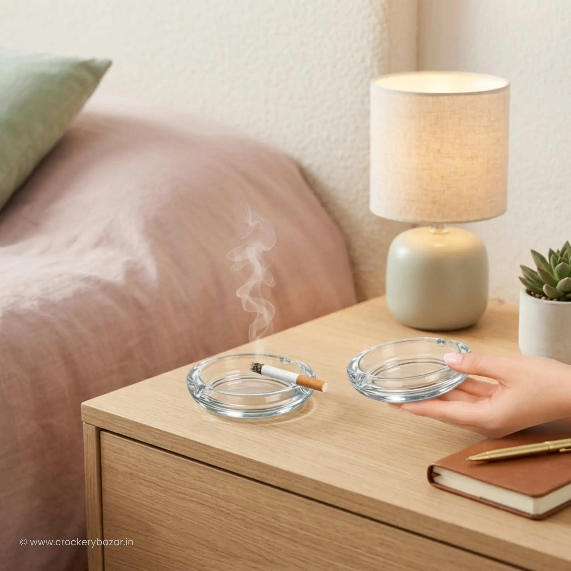Bormioli Rocco Poker glass ashtrays shown on a minimalist wooden bedside table.