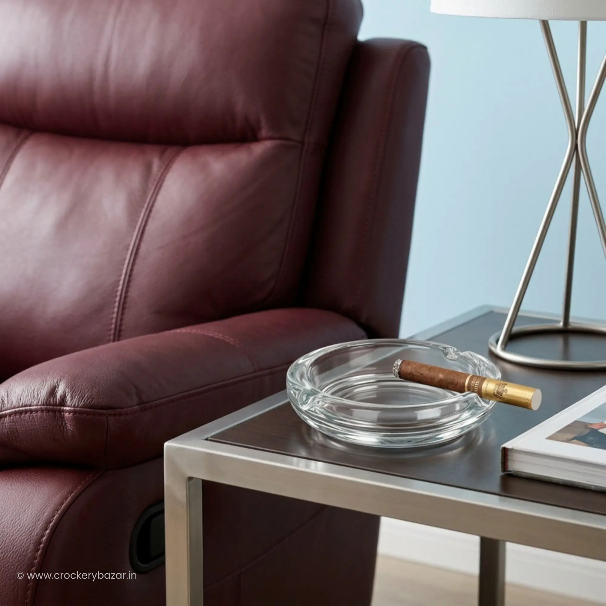 Bormioli Rocco Poker Italian glass ashtray with a cigar on a premium leather lounge side table.