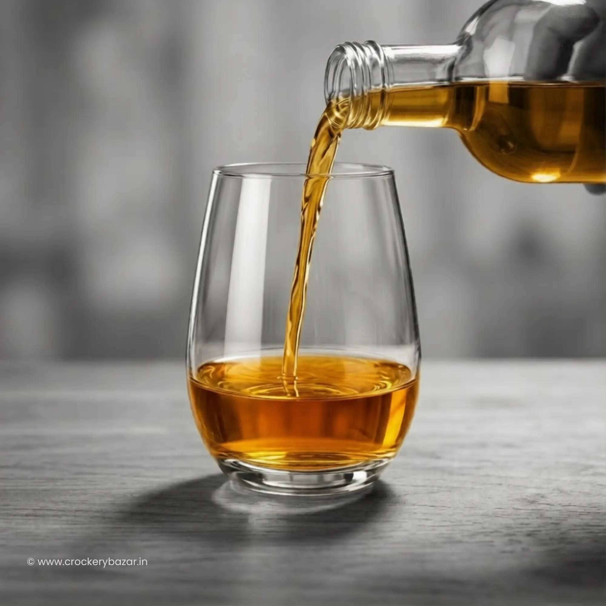 whiskey being poured into Nadir Dubai 460 ml whiskey glass lifestyle shot