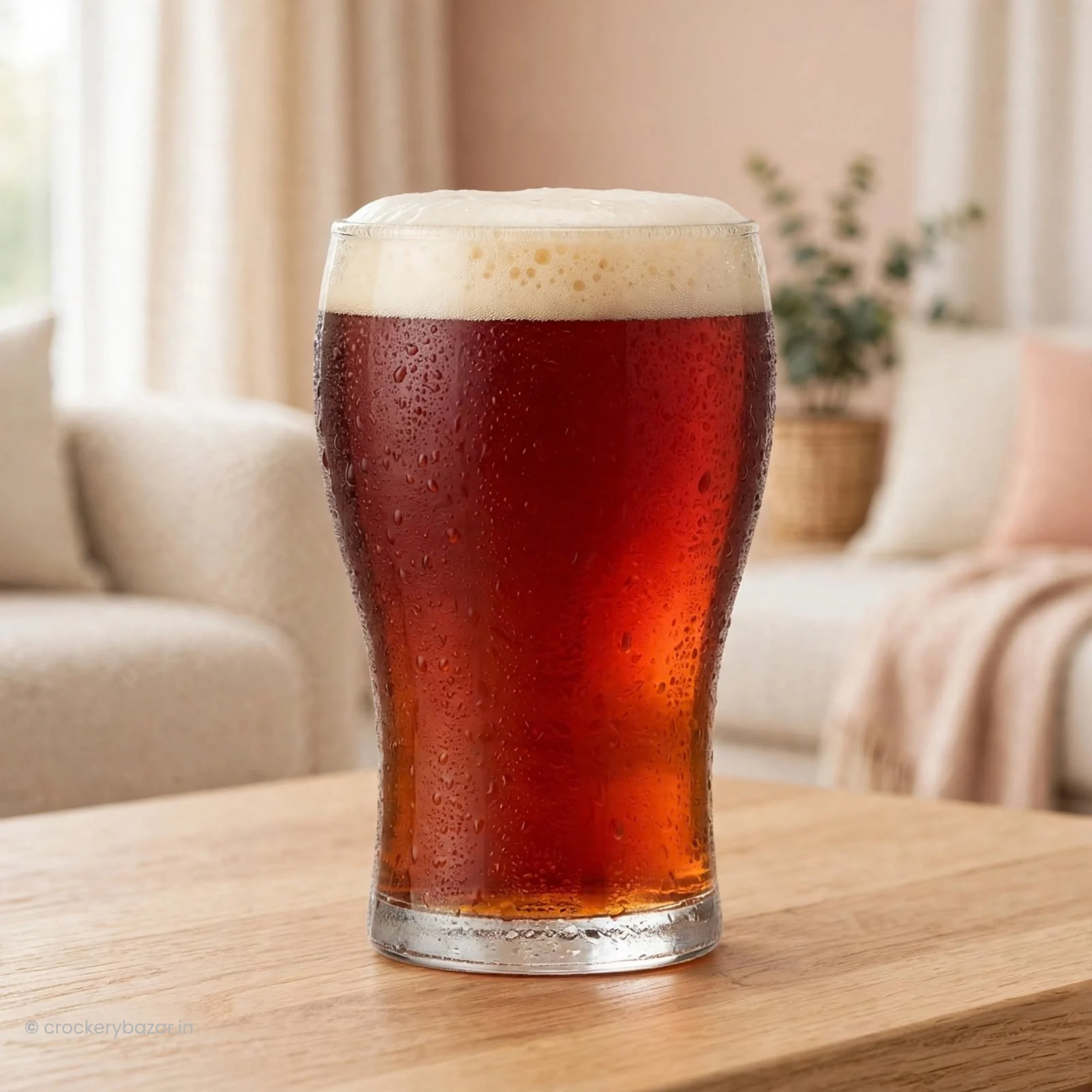 Classic luminarc beer glasses single unit filled with dark ale on a wooden table